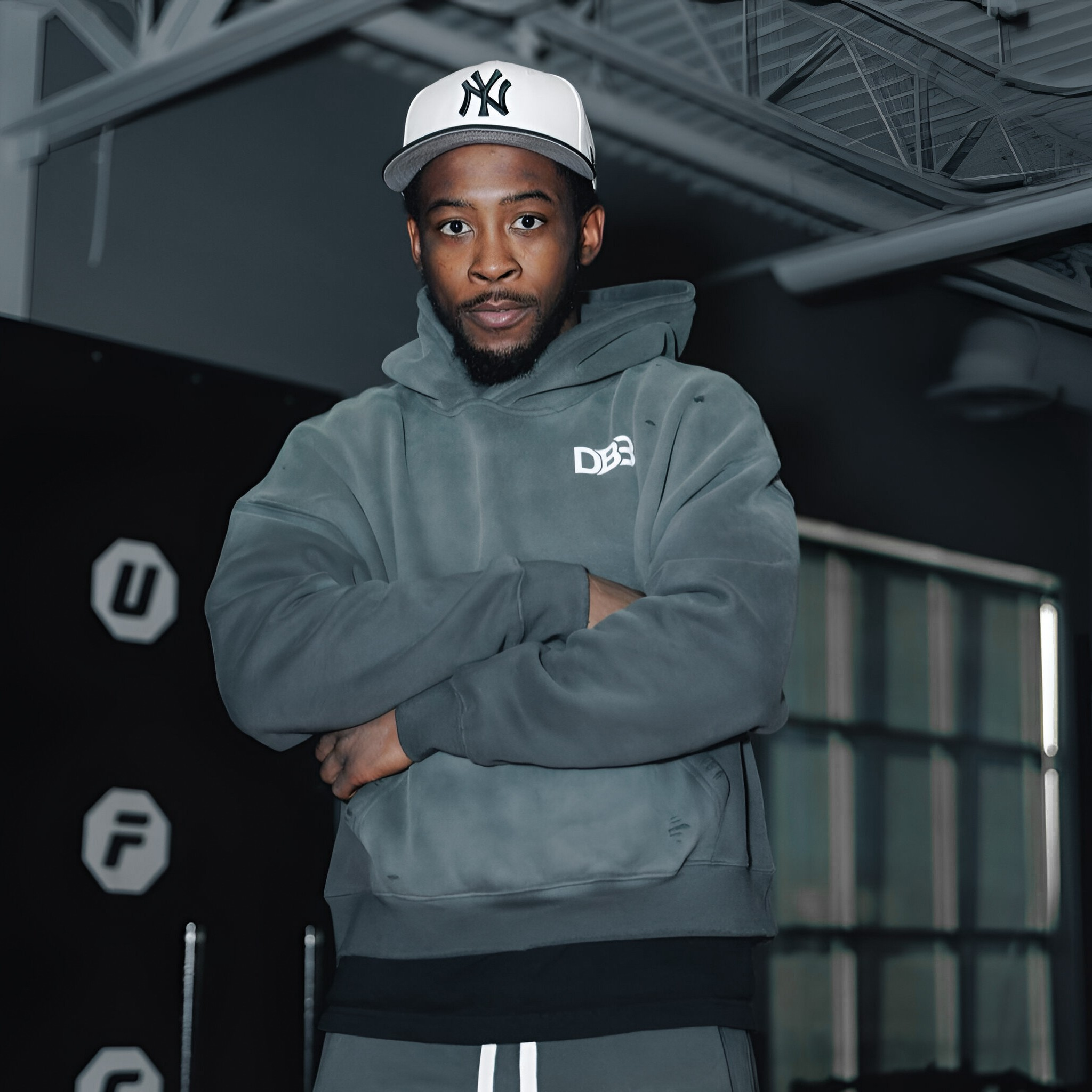 Keyshawn Davis wearing gray sunfaded DB3 Distressed Hoodie