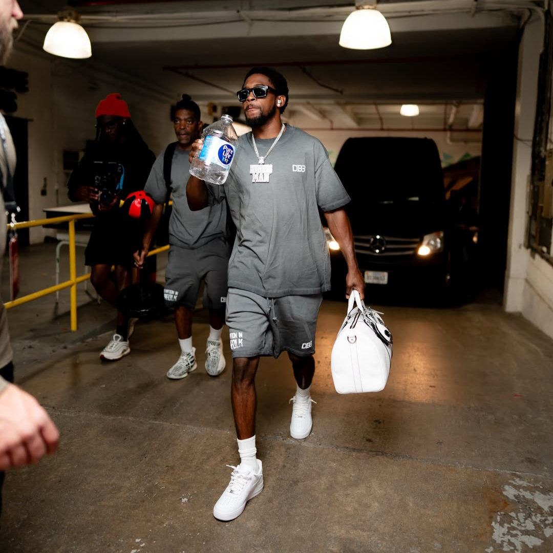 Keyshawn Davis wearing gray reverse-dyed DB3 "Redemption" Supporter Shorts from AKC