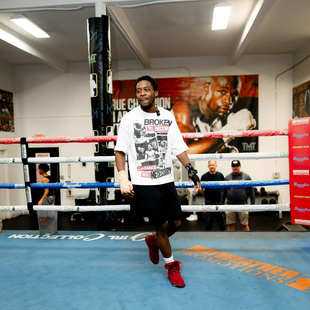 Keyshawn Davis wearing white boxy Keyshawn Davis "Evolution" Tee from AKC
