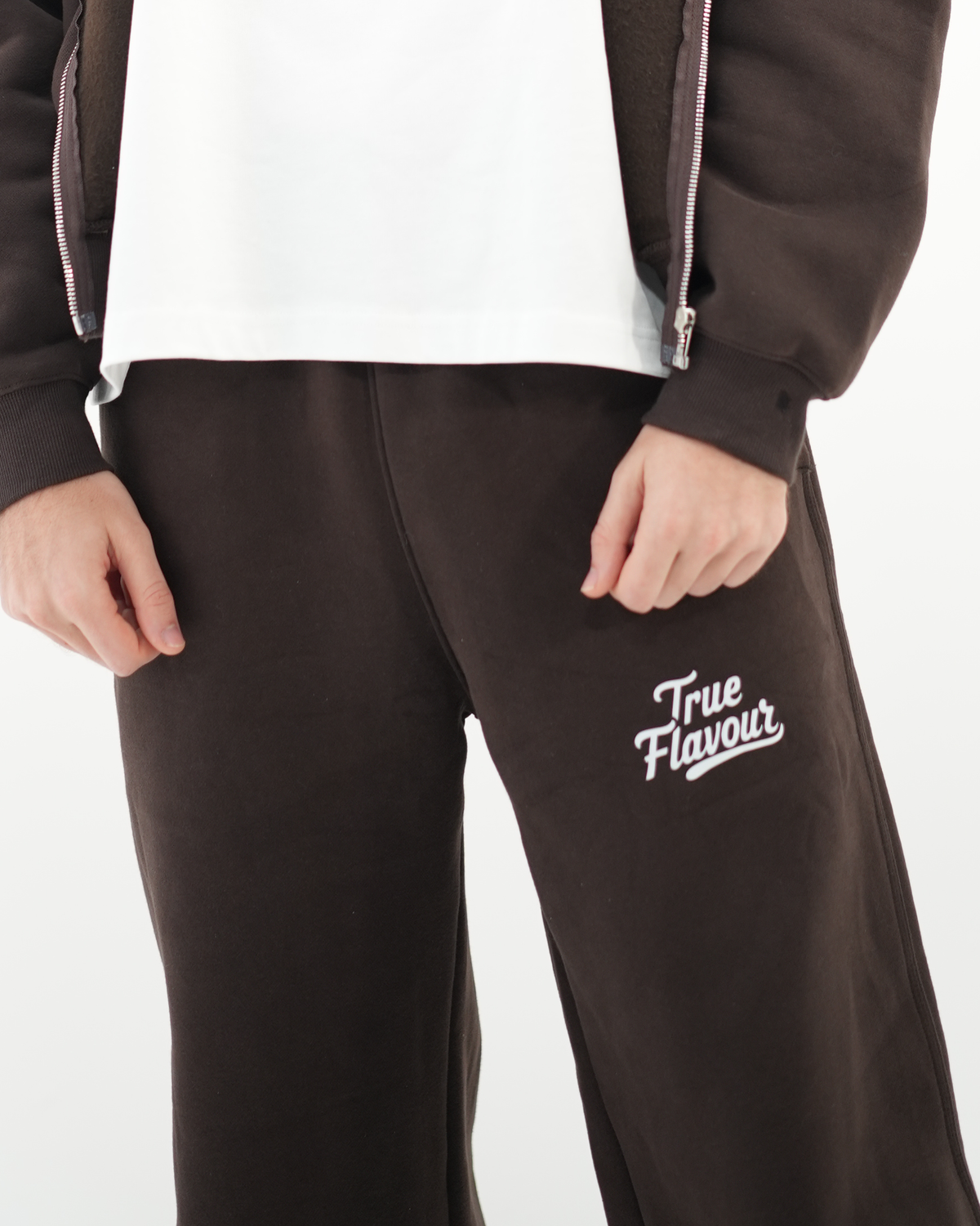 True Flavour Relaxed Straight Leg Sweatpants in brown worn by male model - Front (close-up)