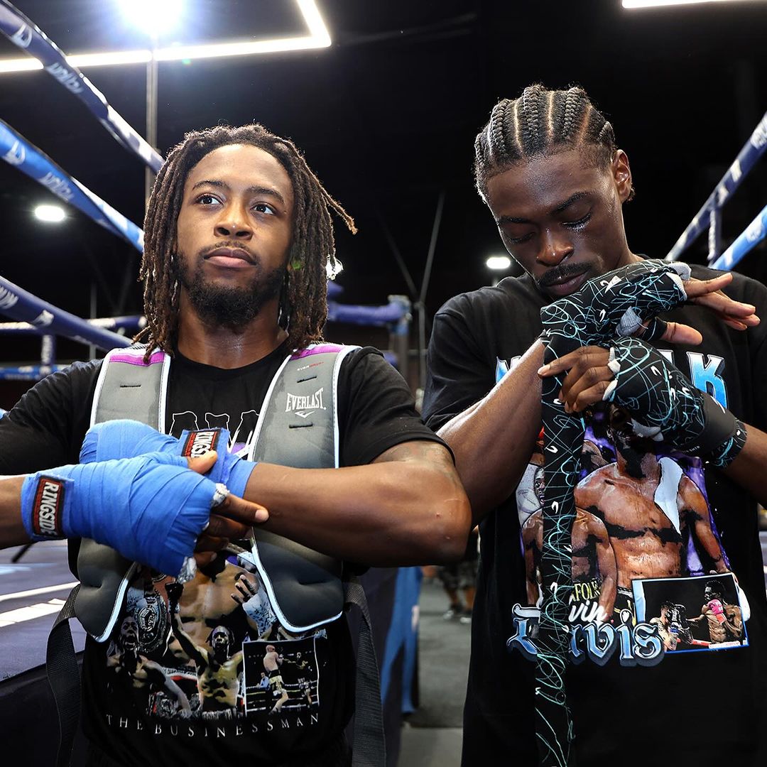 Kelvin and Keyshawn wearing AKC x DB3 T-shirts