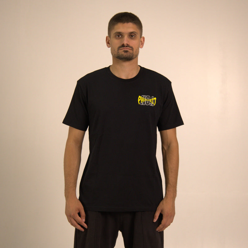 Model wearing simple black tee