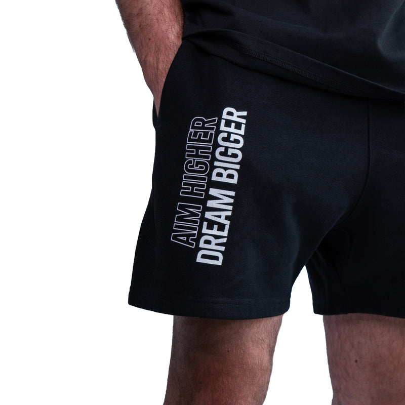 AKC Core Black Relaxed Fleece Shorts Worn by Model - Left Front Close-Up Shot