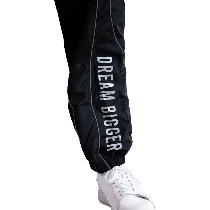 AKC Nightfall Black Reflective Wind Pants Worn by Model - Right Front Close-Up Shot