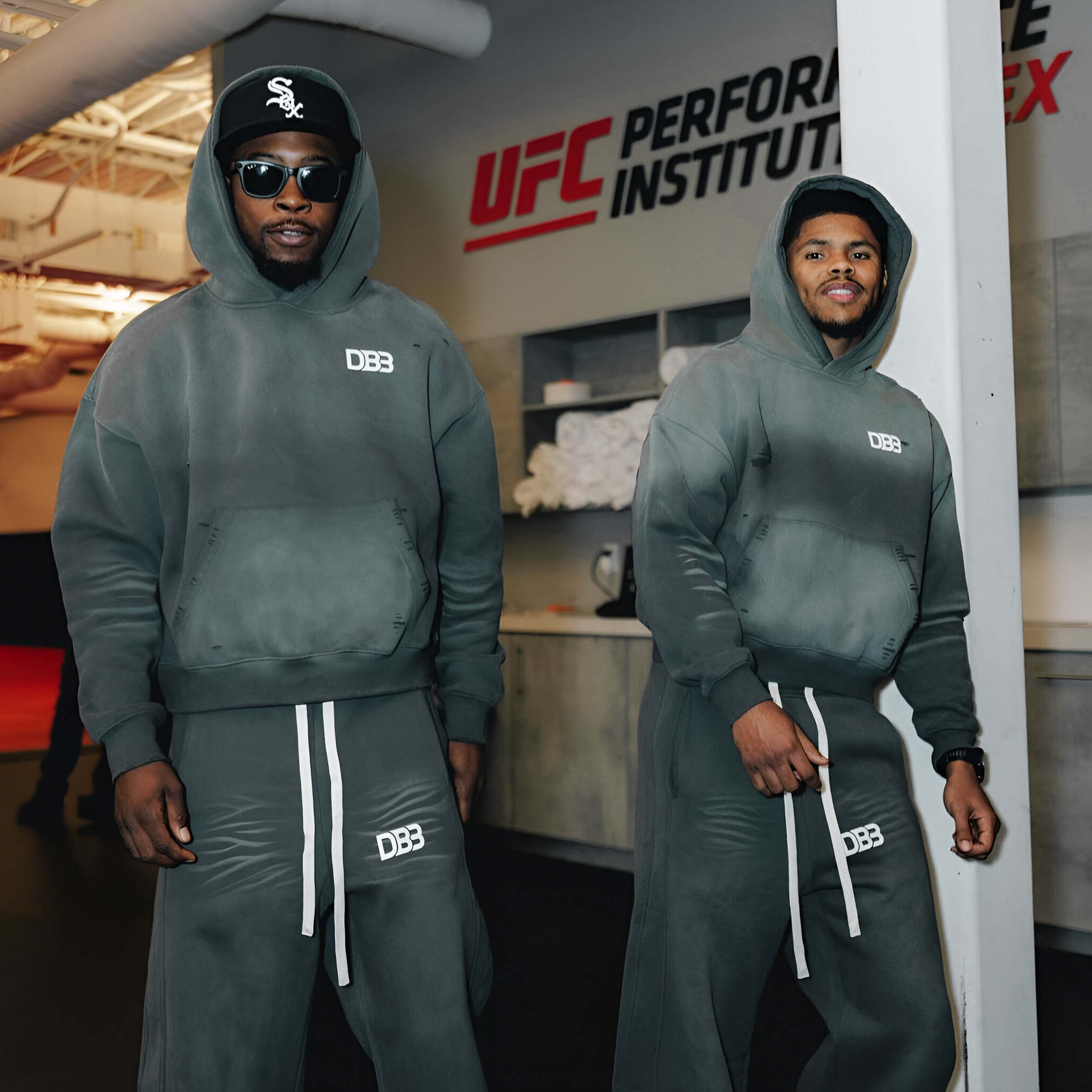 Keyshawn Davis and Shakur Stevenson wearing gray Limited Edition DB3 Distressed Hoodie with matching sweatpants