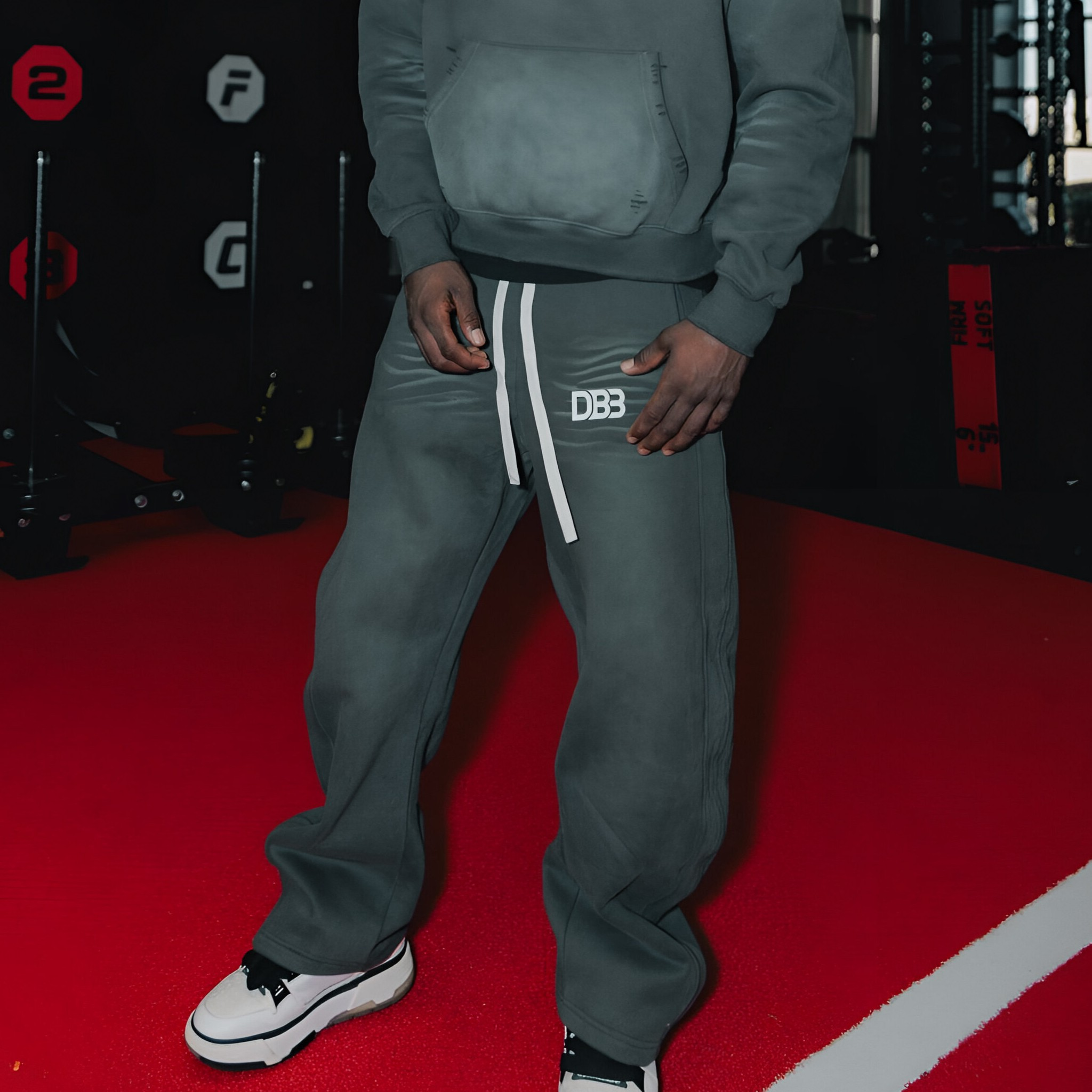 Keyshawn Davis wearing gray sunfaded DB3 Distressed Sweatpants