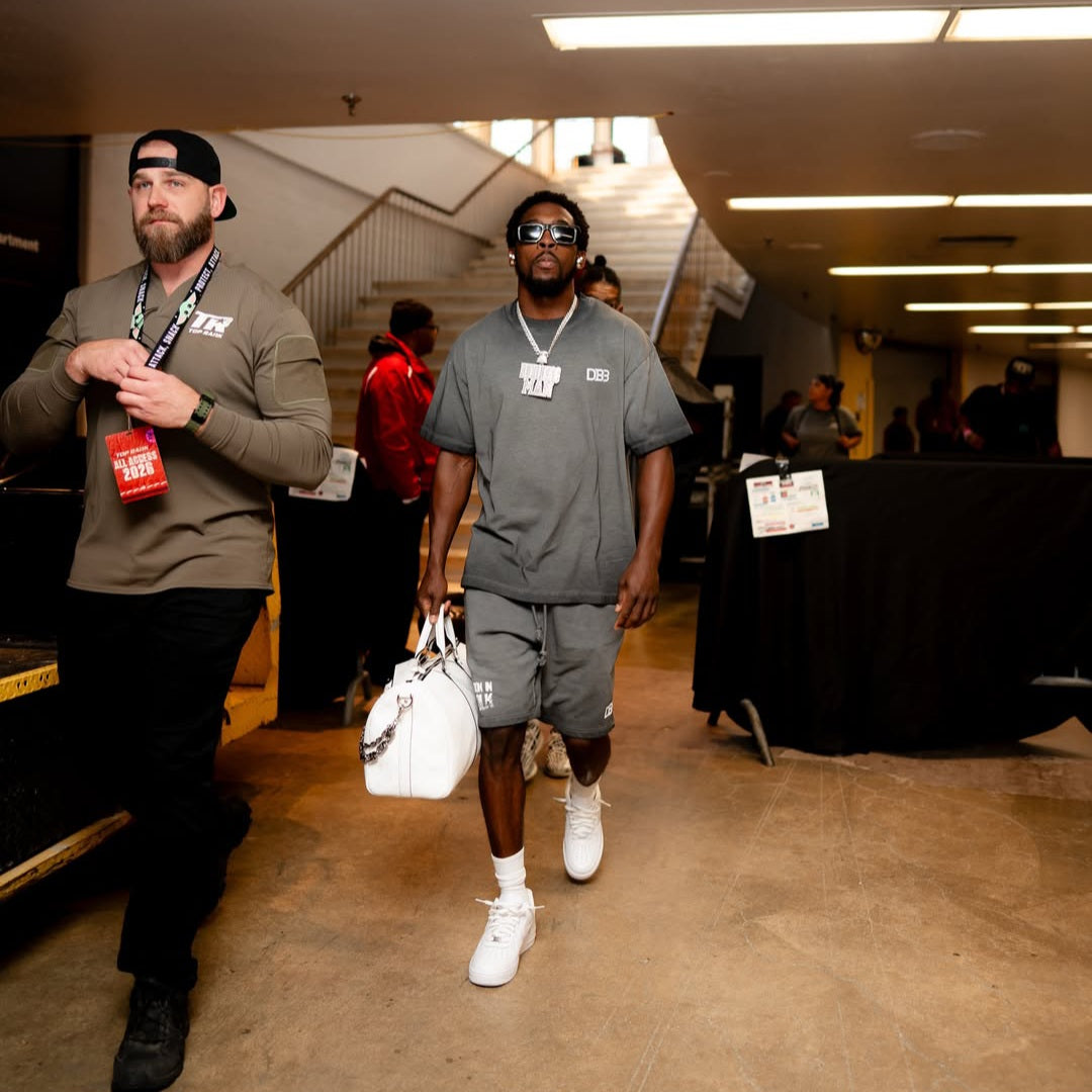 Keyshawn Davis wearing gray reverse-dyed DB3 "Redemption" Supporter Tee from AKC