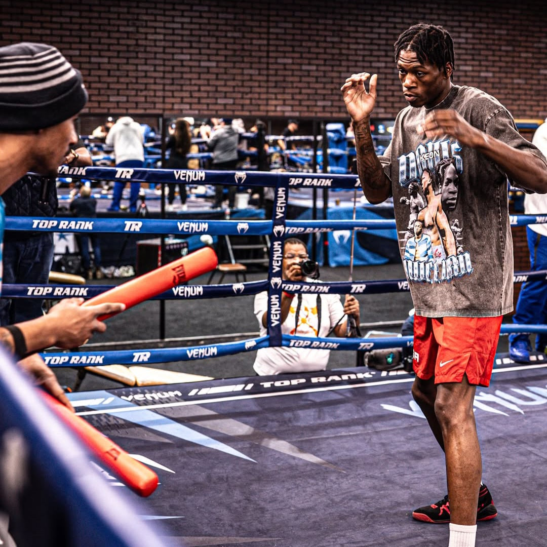 Keon Davis wearing oversized gray vintage supporter tee