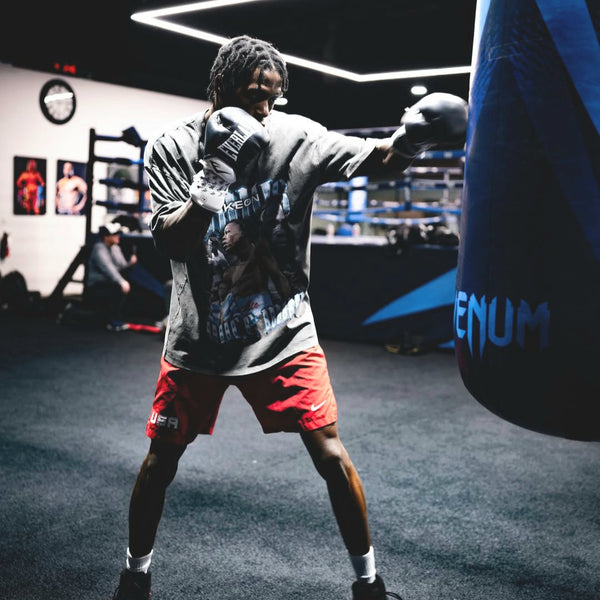 Keon Davis wearing vintage gray supporter t-shirt