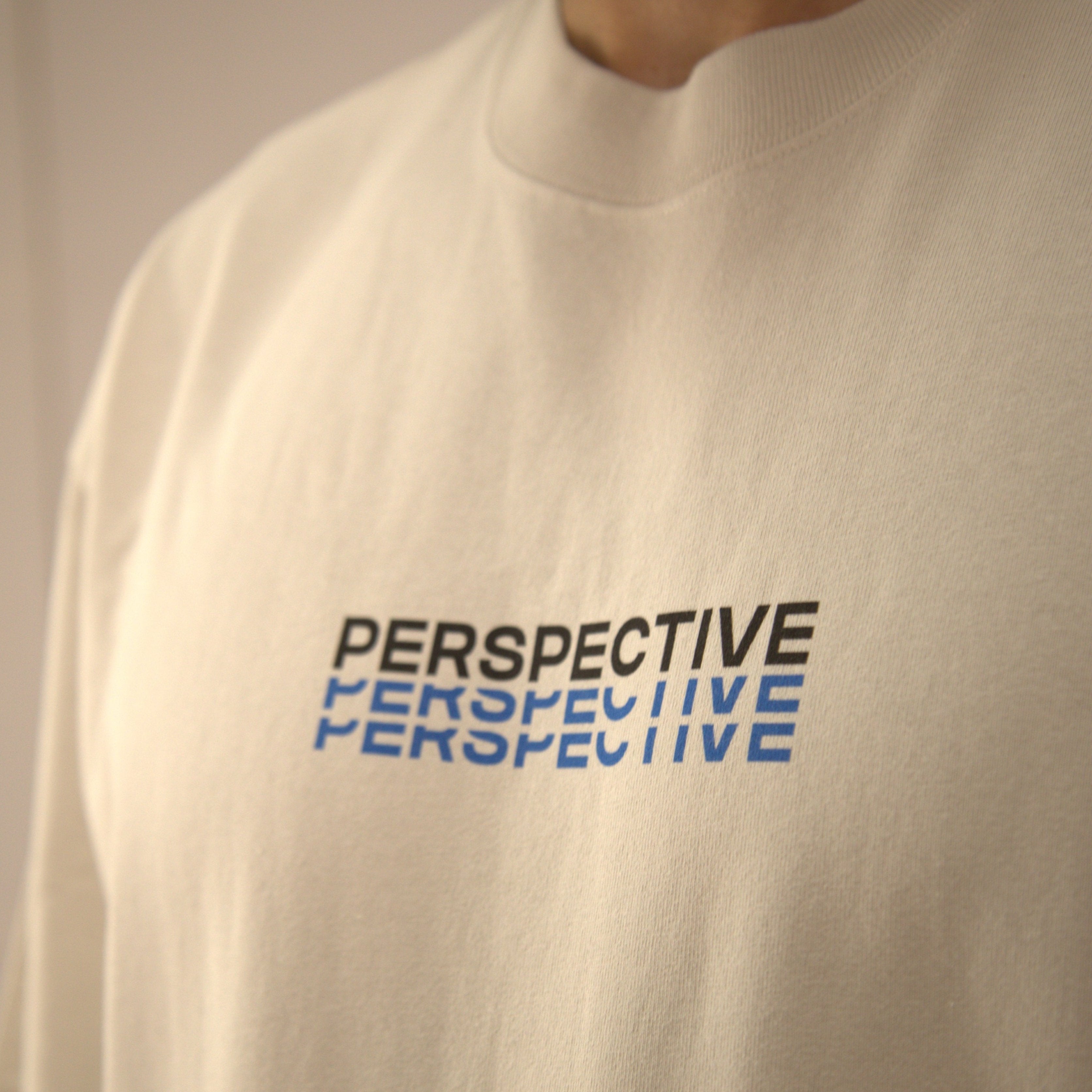Model wearing cream oversized streetwear t-shirt