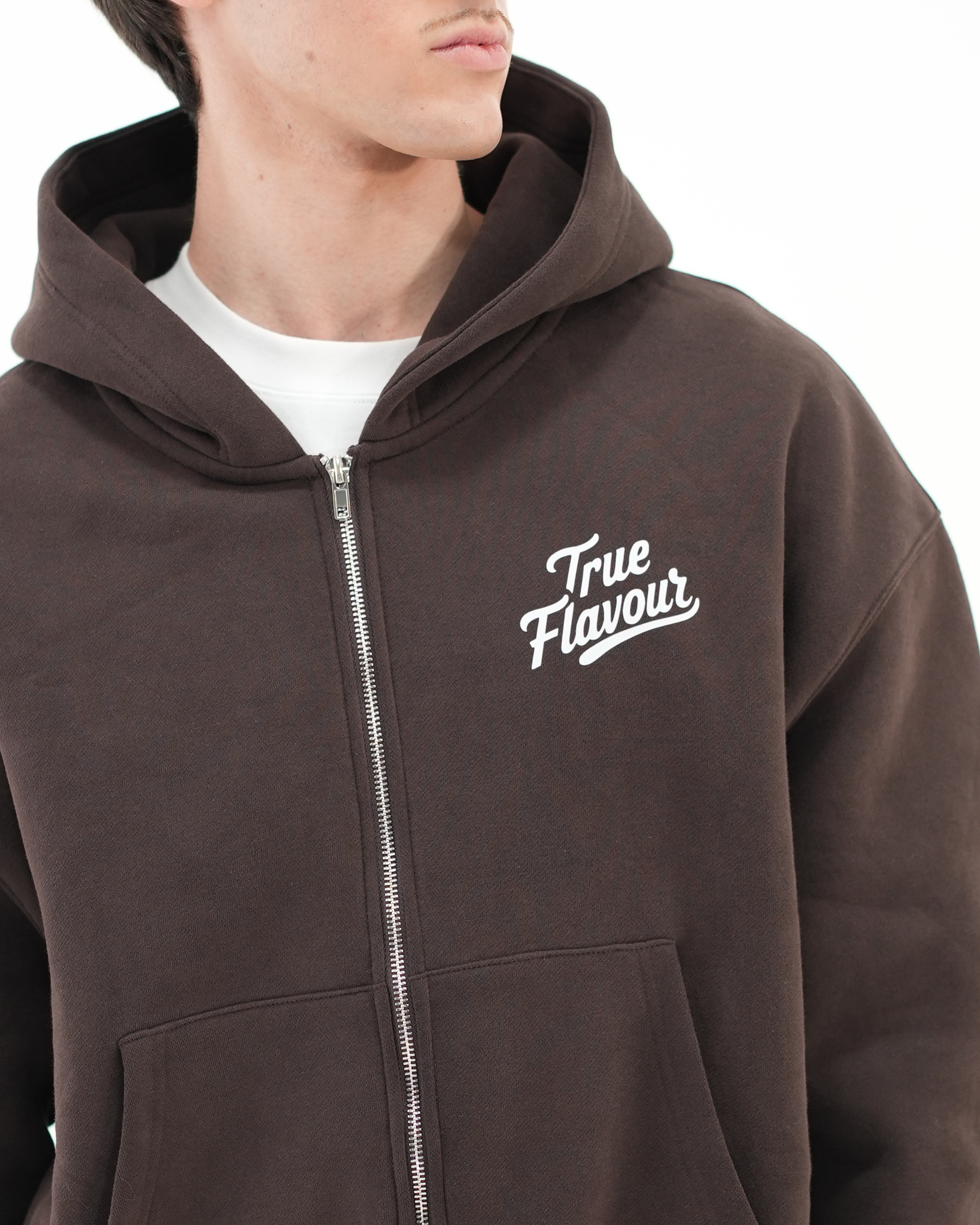 True Flavour Cropped Oversized Hoodie in brown worn by male model - Front (Close-Up)