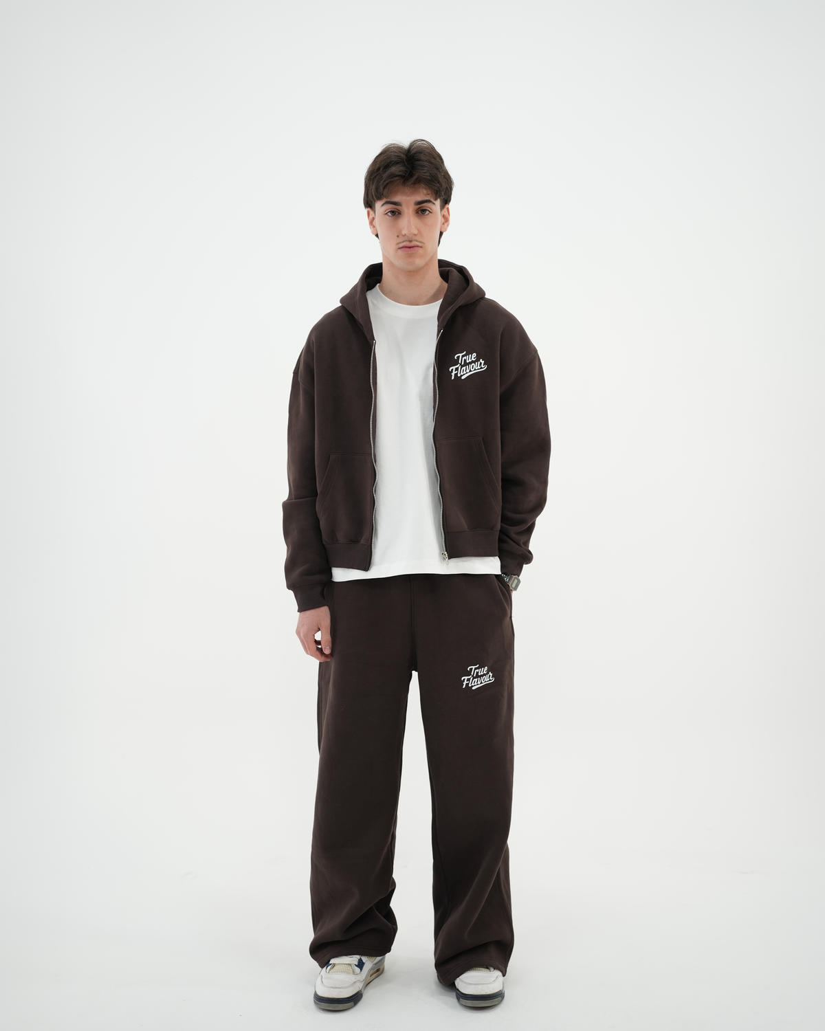 True Flavour Cropped Oversized Hoodie in brown worn by male model - Front (Full-Body)