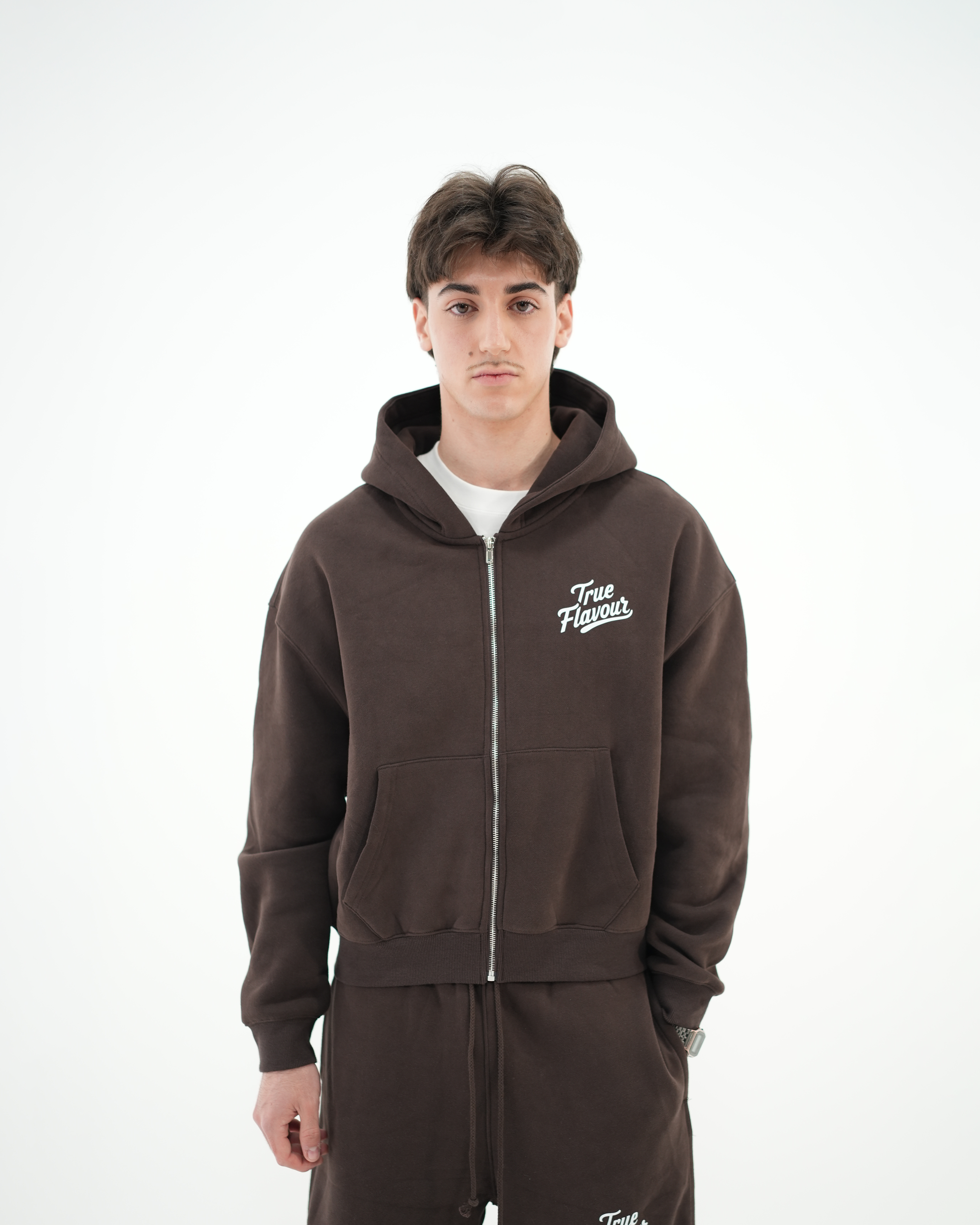 True Flavour Cropped Oversized Hoodie in brown worn by male model - Front (Main)