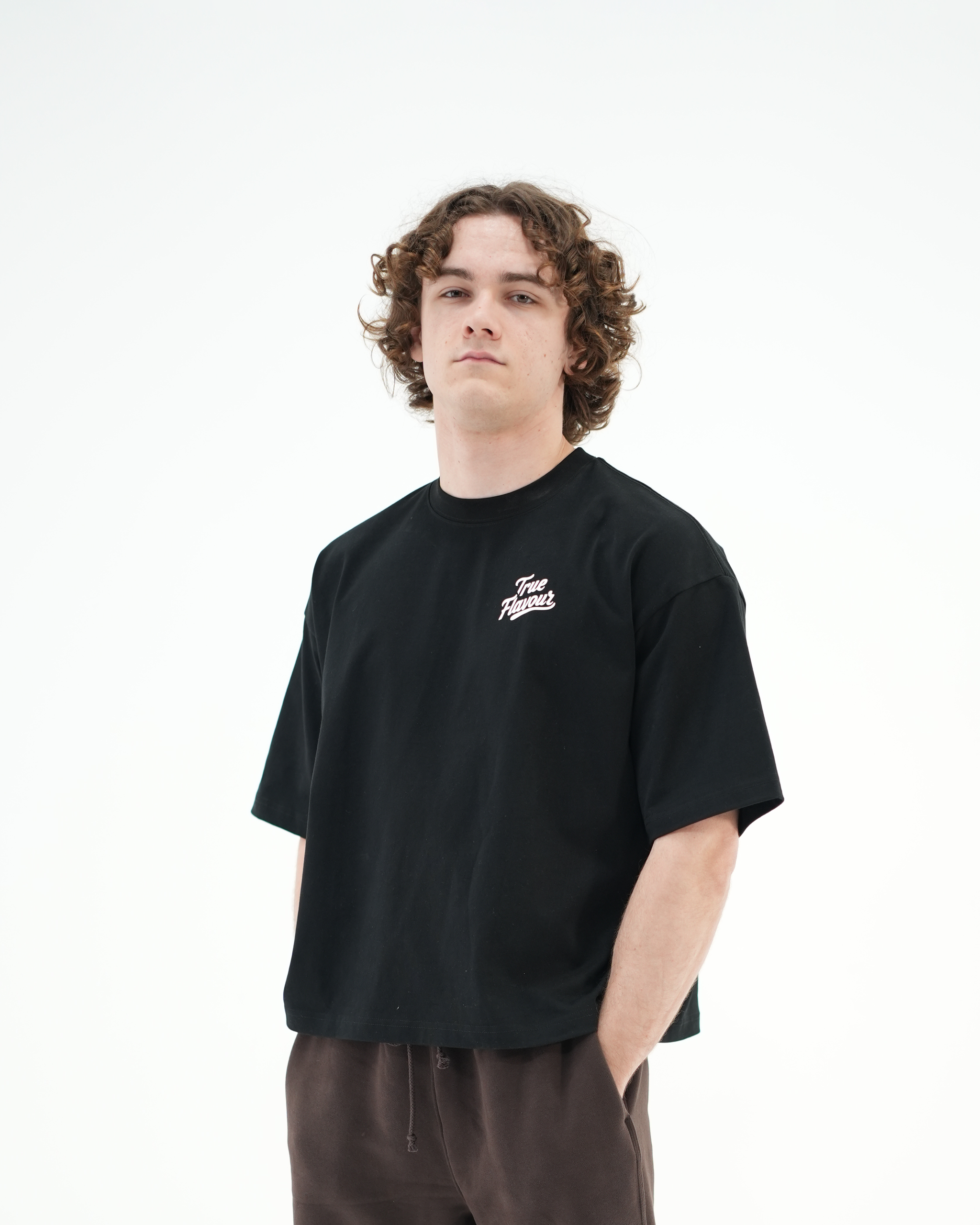 True Flavour Cropped Oversized Tee in black worn by model - Front (Main)