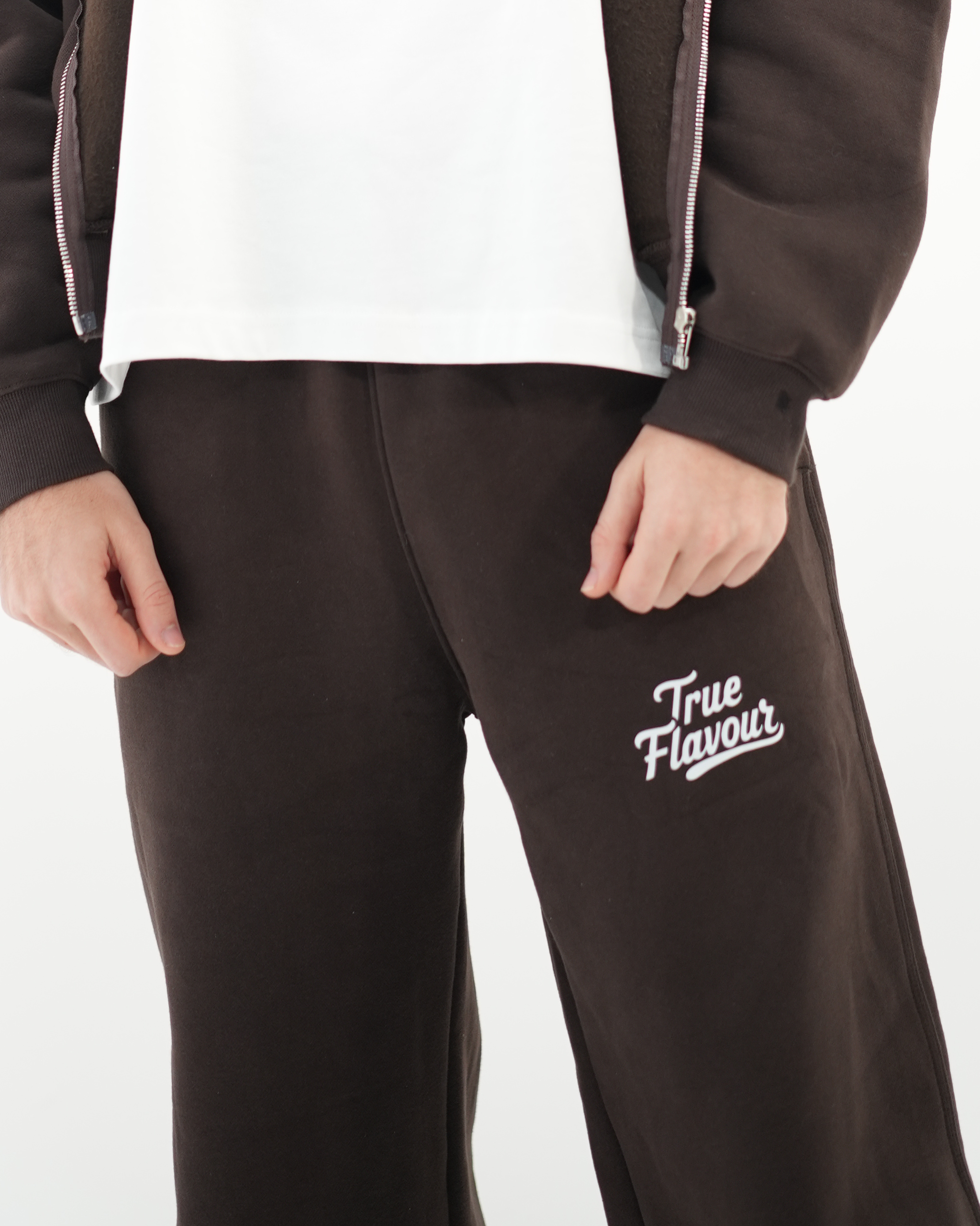 True Flavour Relaxed Straight Leg Sweatpants in brown worn by male model - Front (close-up)