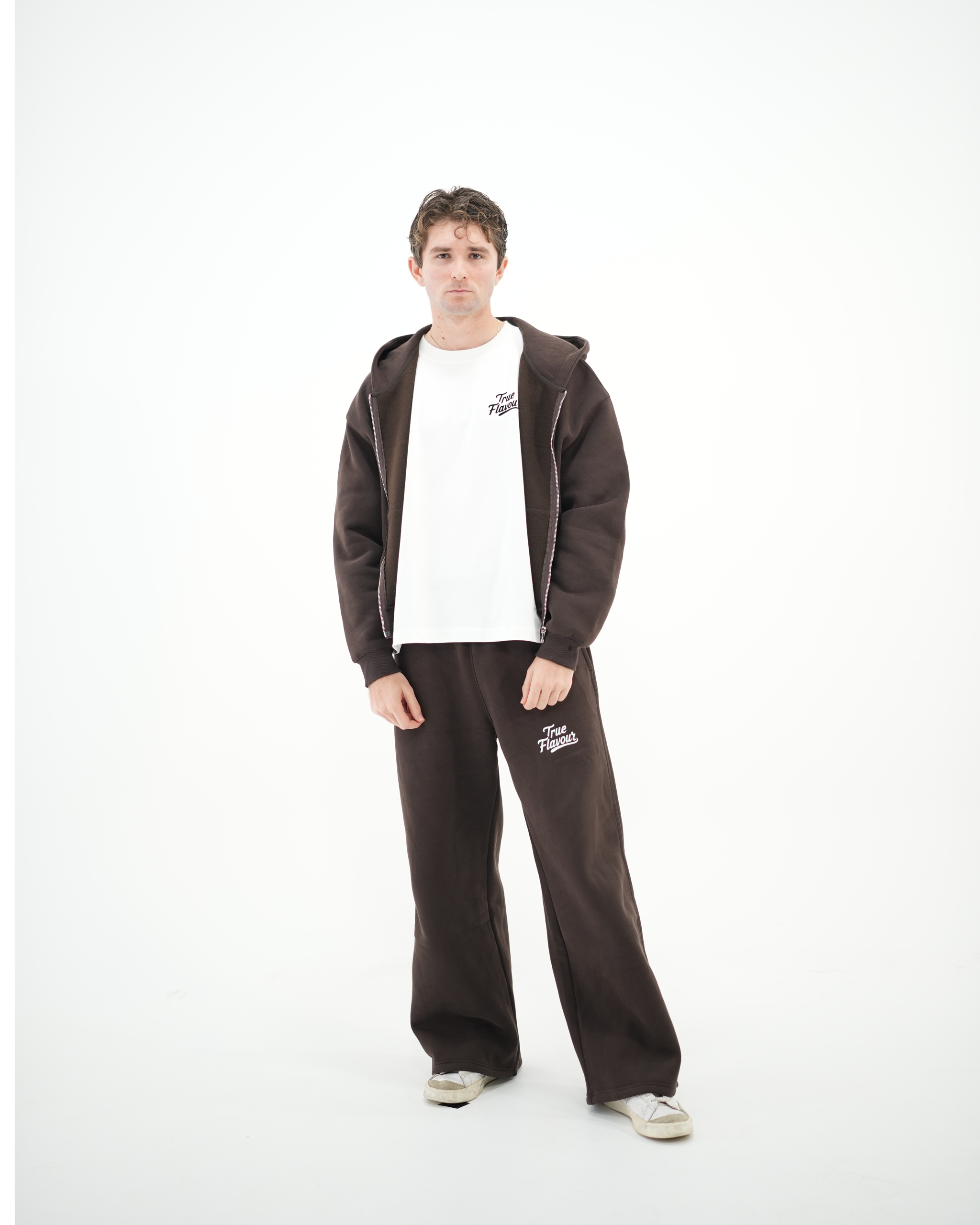 True Flavour Relaxed Straight Leg Sweatpants in brown worn by male model - Front (Full Body)